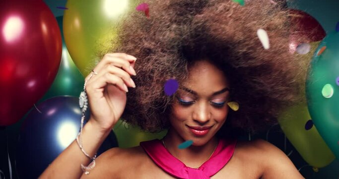 Dance, crazy and black woman at a party, birthday or celebration event with confetti and balloons. Freedom, dancing and happy African girl at a rave or techno disco with music to celebrate with smile