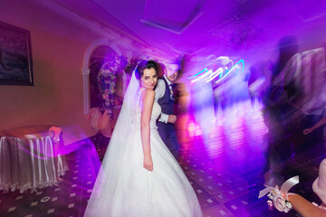 the incendiary bride dances after the ceremony against the backdrop of the guests.