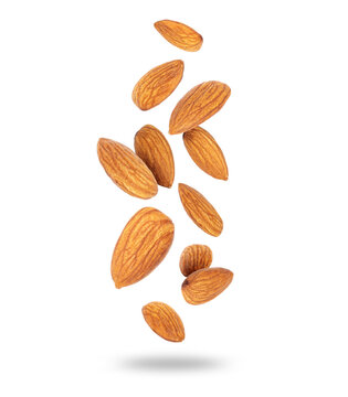 Dried almonds close-up in the air isolated on a white background