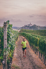 Man running in the vineyards of Langhe