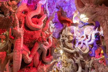 A cave full of mythical animal art called Naga.