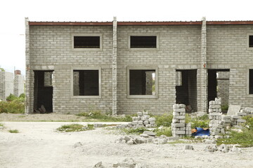 Fototapeta na wymiar Houses in the process of being built