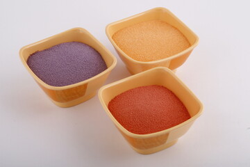 Powdered juice ingredients in yellow bowls