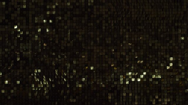 Abstract golden disco background. Moving light, reflections and glare. Music, party and dance concept.