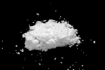 White snow isolated on black background close up