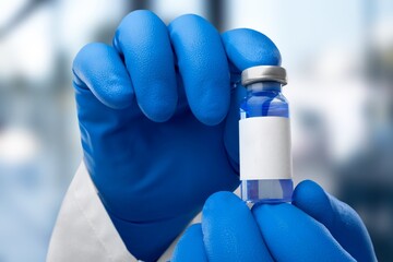Vaccination concept. Doctor hold vial of vaccine