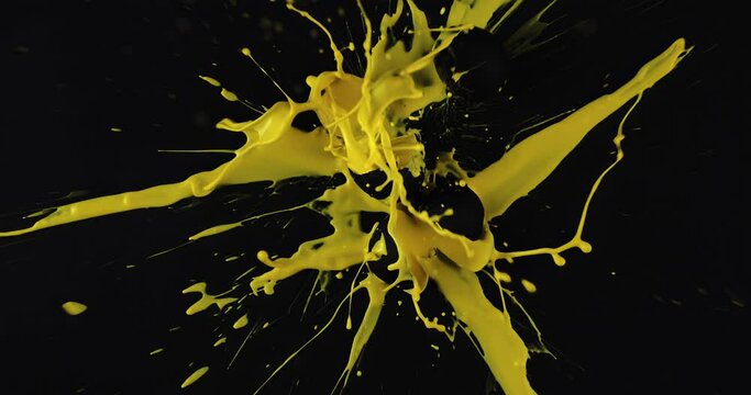 Black colored eggs yellow paint inside drop falling down splashing exploded, dye splash, dark design abstract, paint balls splashes crush slow motion food photography creative, colorful Easter egg