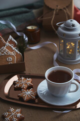 Aesthetics Christmas mood with gingerbread cookies, cocoa, light, candles background