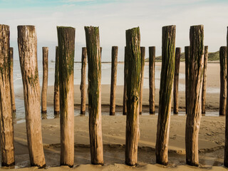 Ocean view in Domburg, Netherlands. Beautiful wooden pole at the beach