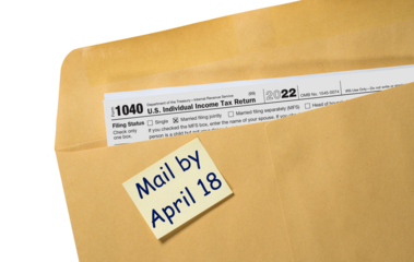 Printed copy of Form 1040 for income tax return for 2022 with reminder for April 18 2023 deadline