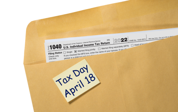 Printed copy of Form 1040 for income tax return for 2022 with reminder for April 18 2023 deadline