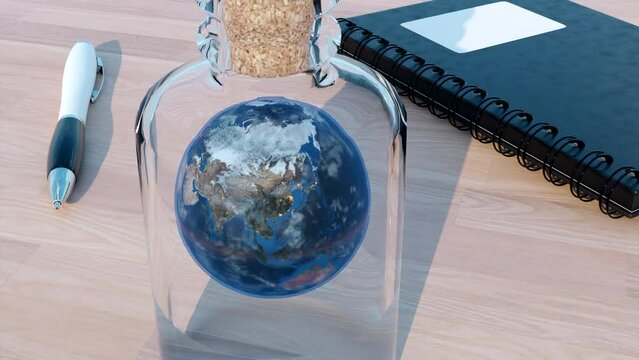 Rotating Earth globe inside glass bottle. Design. Surreal illustration of the planet on the table, notebook and a pen.