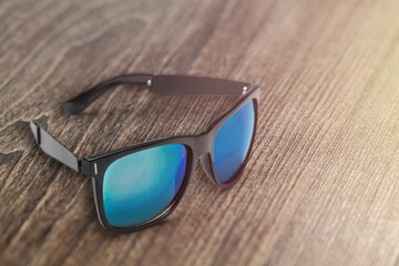 Beautiful trendy modern sunglasses on the desk