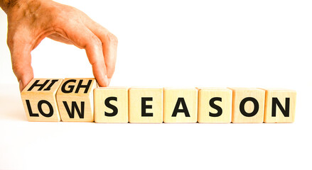 High or low season symbol. Concept words High season and Low season on wooden cubes. Businessman...
