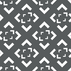 Obraz premium Vector. Black and white abstract ethnic seamless pattern. Background of angle brackets. Mosaic. Design of packaging paper, textile printing, web design, cover, advertising and typographic products.