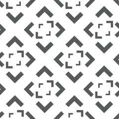 Vector. Black and white abstract ethnic seamless pattern. Background of angle brackets. Mosaic. Design of packaging paper, textile printing, web design, cover, advertising and typographic products.