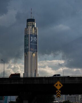 Vertical shot of Baiyoke Sky Hotel with JIB advert in Bangkok, Thailand