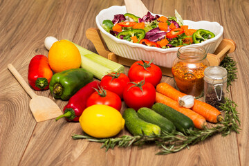 Healthy and fresh salad in bowl with vegetables and fruit