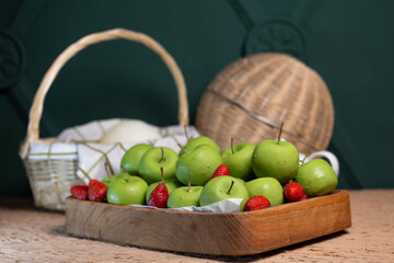 basket with green apples on the table