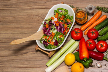 Healthy and fresh salad in bowl with vegetables and fruit