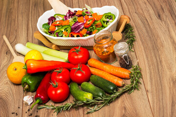 Healthy and fresh salad in bowl with vegetables and fruit