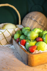 basket with green apples on the table
