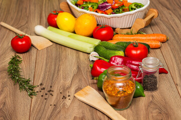 Healthy and fresh salad in bowl with vegetables and fruit