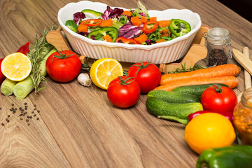 Healthy and fresh salad in bowl with vegetables and fruit