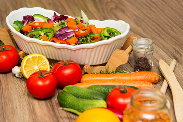Healthy and fresh salad in bowl with vegetables and fruit