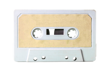 Isolated old vintage cassette tape, obsolete music tech from the 1980s. Light brown sand label, gray plastic body.
