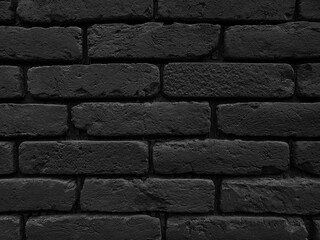 Black brick wall grunge texture background. Close up of brick tiles in a row. - 550088844