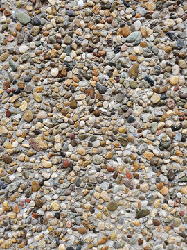 Decorative concrete texture with small pebbles background wall.
