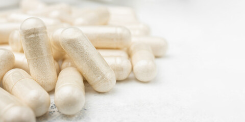 White medicine capsules, vitamin pills or drugs, medication treatment, health care concept