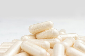 White medicine capsules, vitamin pills or drugs, medication treatment, health care concept