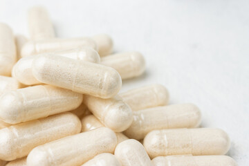 White medicine capsules, vitamin pills or drugs, medication treatment, health care concept