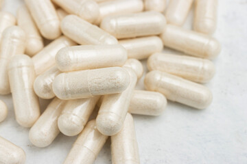 White medicine capsules, vitamin pills or drugs, medication treatment, health care concept