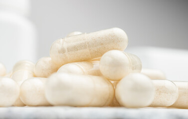 Fototapeta na wymiar White medicine capsules, vitamin pills or drugs, medication treatment, health care concept