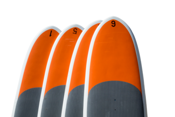 Four stand up paddle boards isolated against white