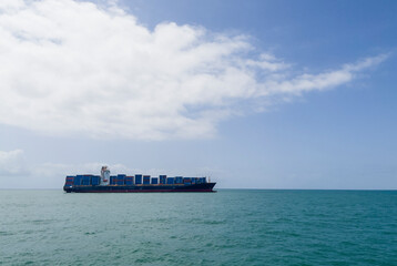 Container ship or container ship loaded with containers freight on the Indian ocean waves near the...