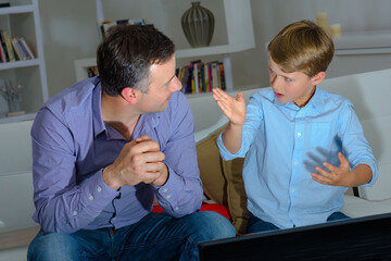 Child talking to adult making hand gestures