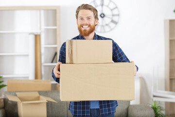 happy man holding package parcel boxes