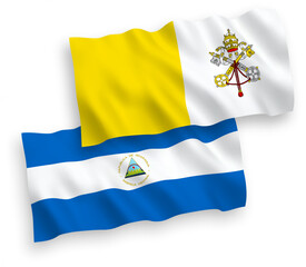 National vector fabric wave flags of Nicaragua and Vatican isolated on white background. 1 to 2 proportion.