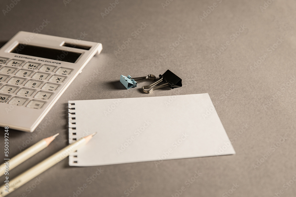 Aufkleber empty paper with pencils and calculator on the table