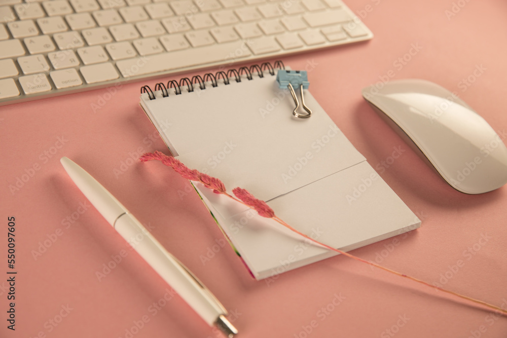 Poster keyboard and notepad on desktop