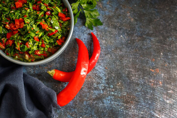Fresh Chimichurri sauce or Chimmichurri salsa or sauce made of parsley, garlic, oregano, hot pepper, olive oil, vinegar