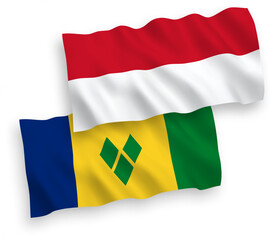 National vector fabric wave flags of Indonesia and Saint Vincent and the Grenadines isolated on white background. 1 to 2 proportion.