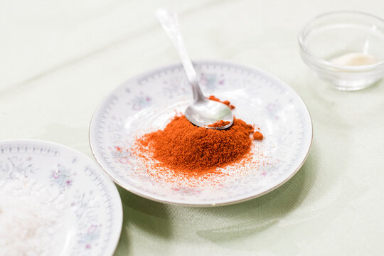 Sweet paprika on a plate, preparation of canadian mojo