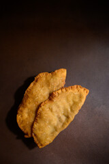 Caucasian cuisine. Uzbek Eastern Tatar cuisine, cheburek with meat and greens. Fried pie with meat and onions. Traditional Turkish and Mongolian dish.