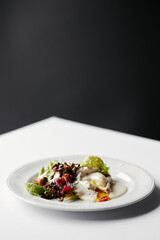 salad with herbs, mushrooms and poached egg