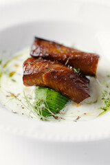 eel baked and laid on avocado